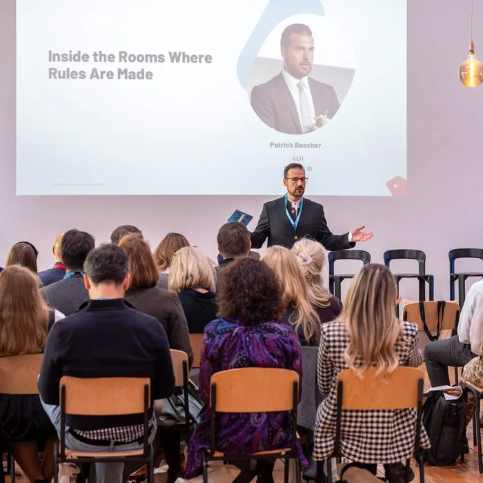 Speaker on stage at EQS Connect